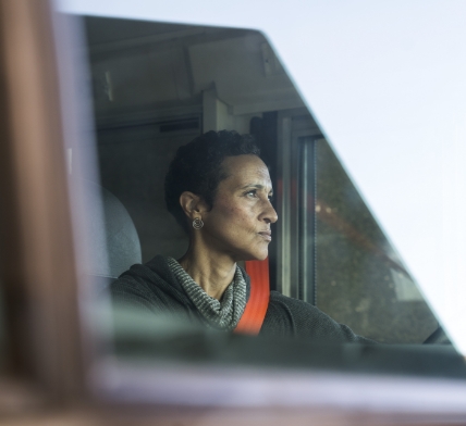 IC Bus Woman Bus Driver Looking Out Windshield