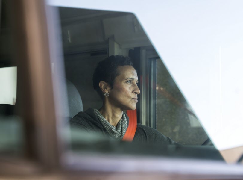 IC Bus Woman Bus Driver Looking Out Windshield