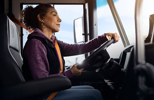 Woman driving bus