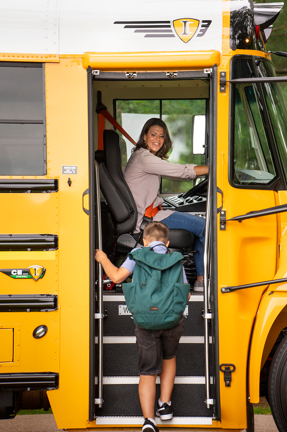 A child boarding a bus