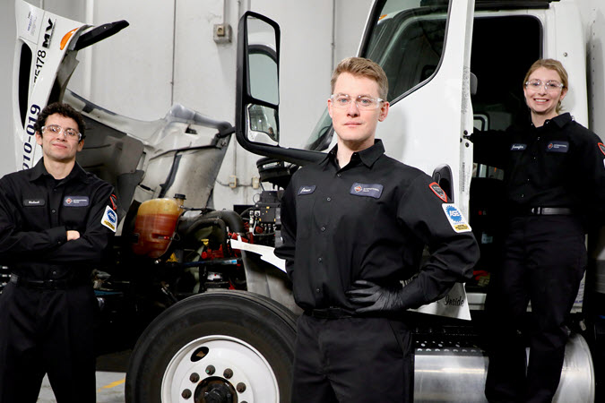Technicians in front of truck