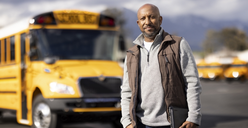 Man in front of bus